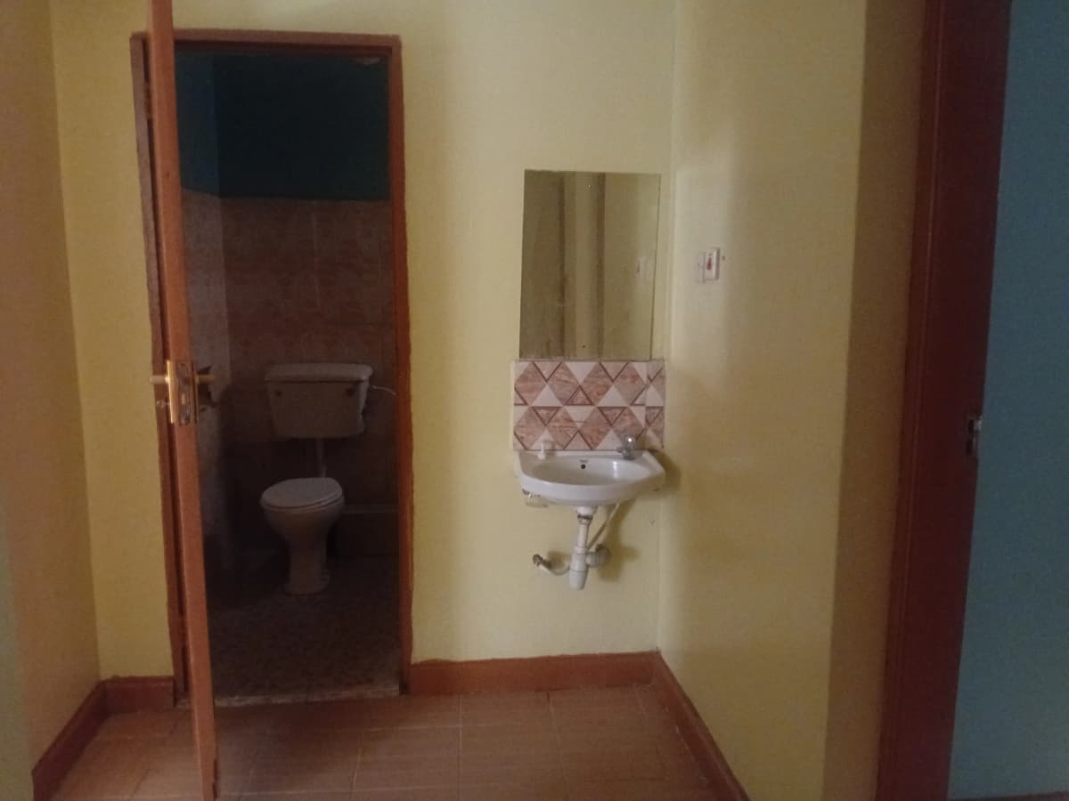 Building corridor with bathroom entry and paper towel dispenser