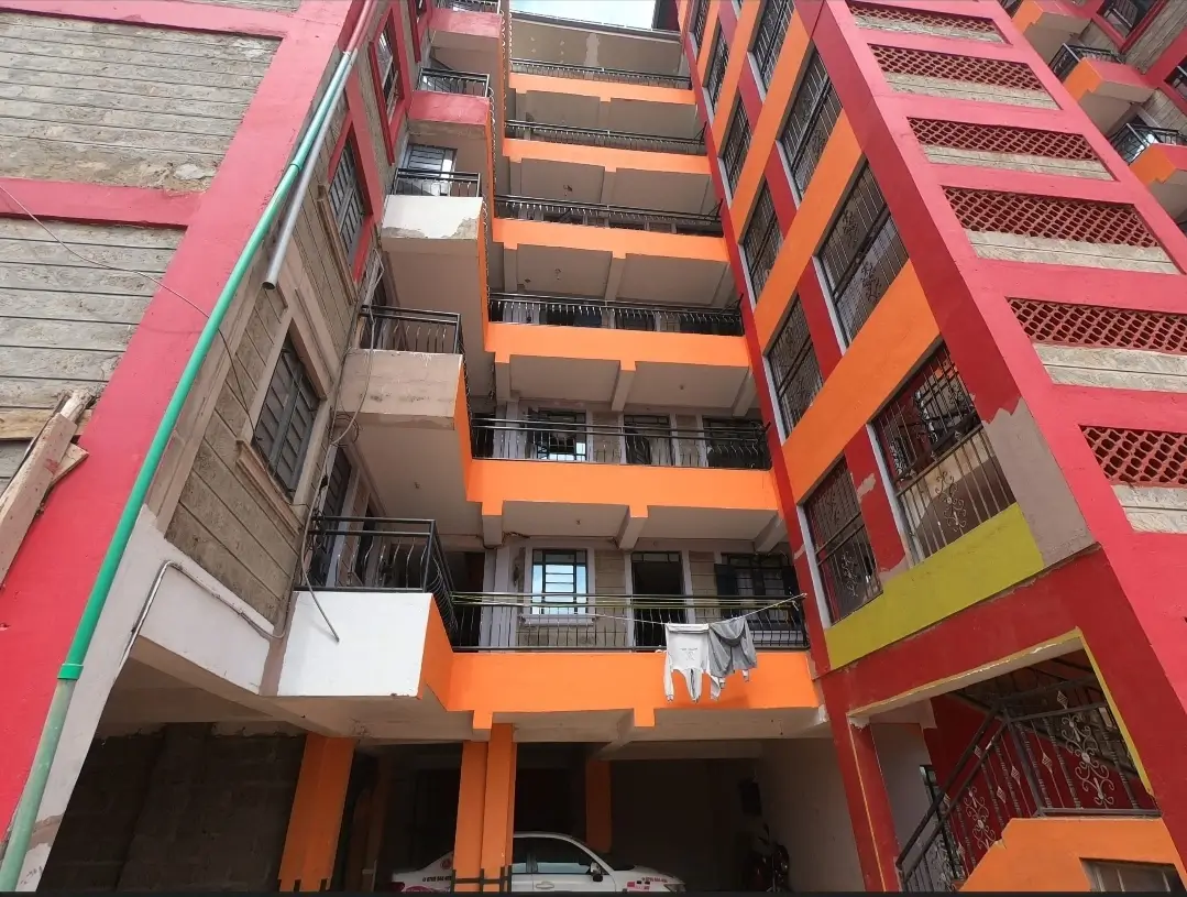 Colorful multi-story residential building facade with balconies
