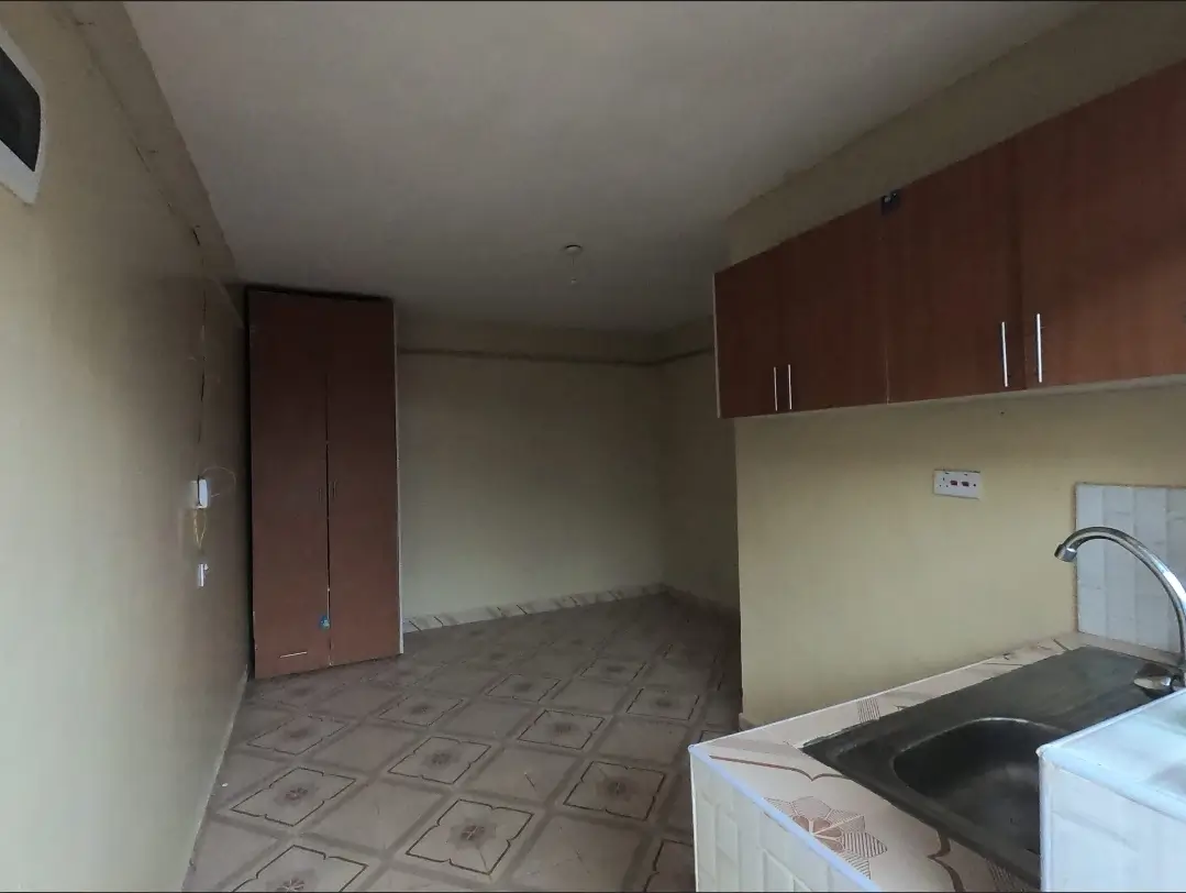 Kitchen with dark wood cabinets and stainless steel sink