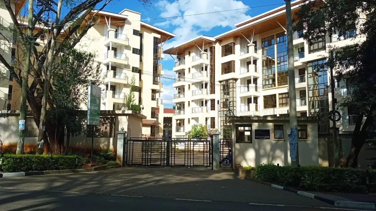 Modern residential compound with gated entrance and landscaping