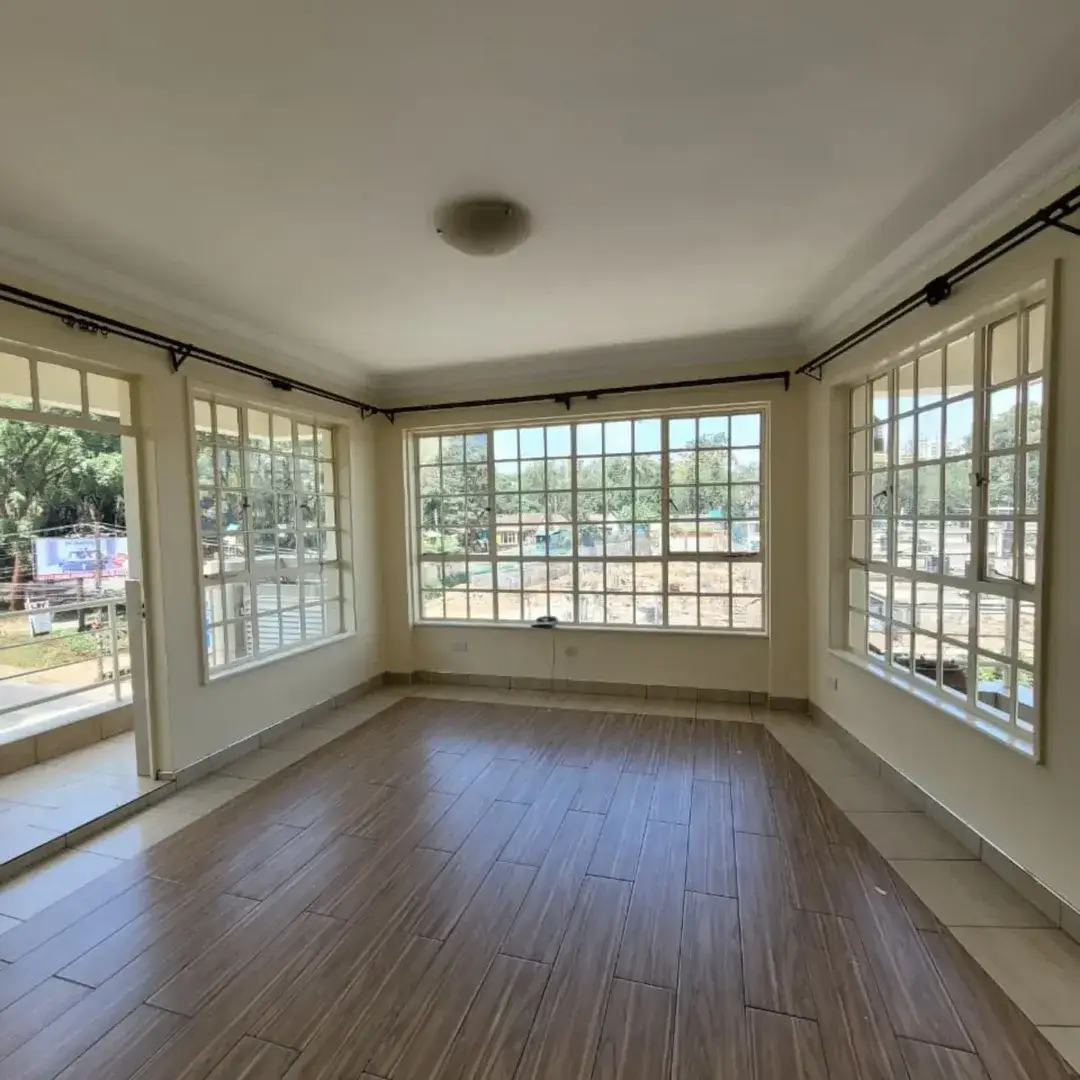 Bright living room with wood floors and expansive windows