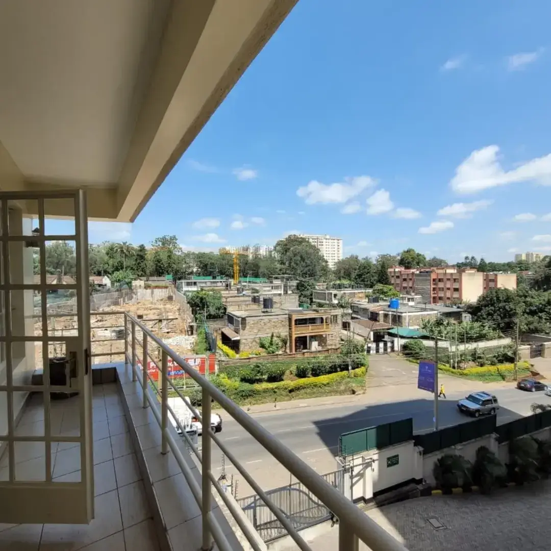 Elevated balcony overlooking urban neighborhood with construction sites