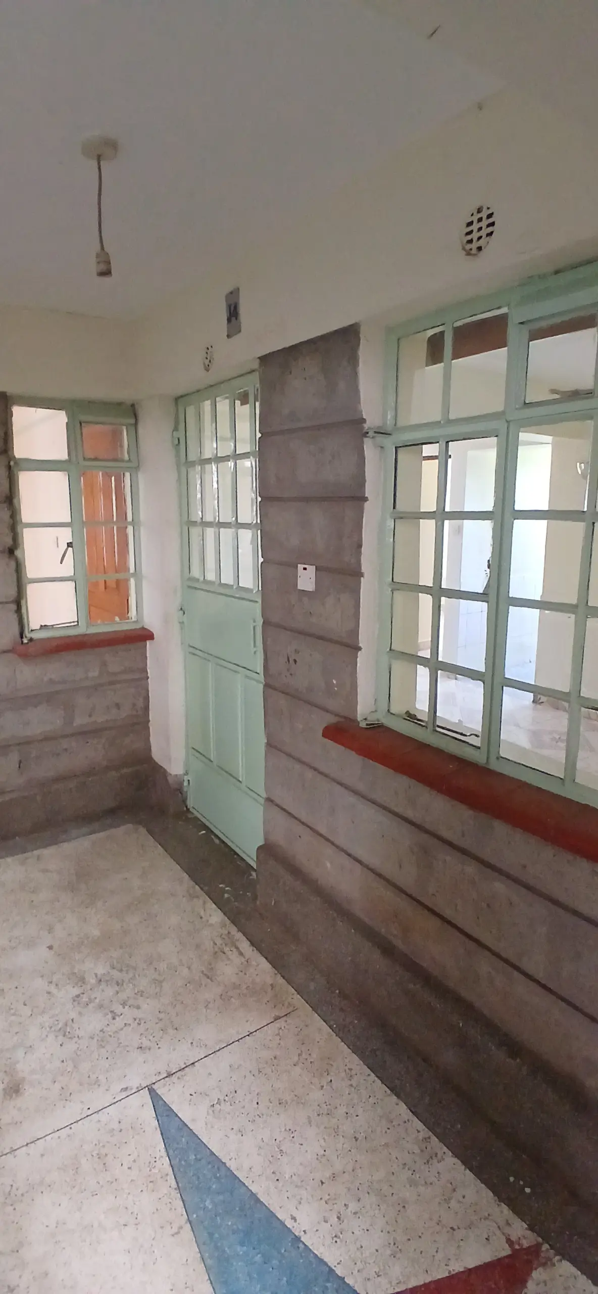 Building entrance hallway with glass doors and windows