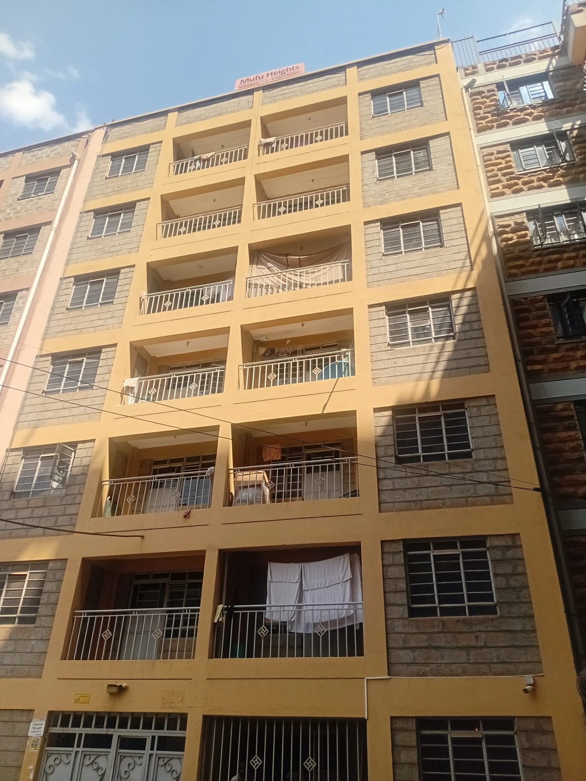 Multi-story residential building facade with balconies