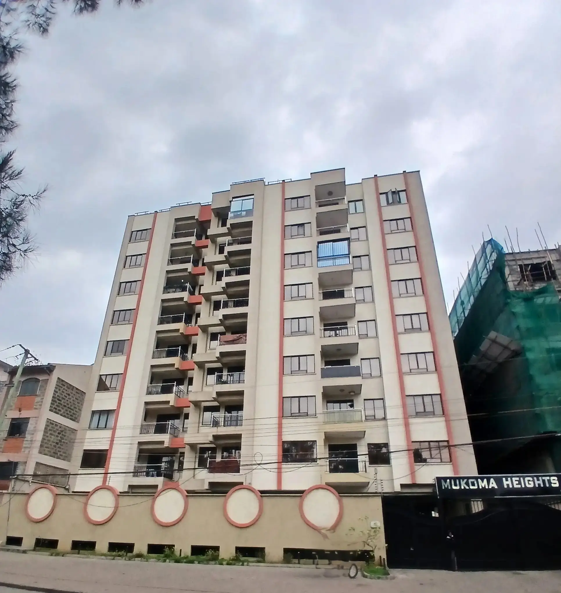 Multi-story residential apartment building facade with balconies