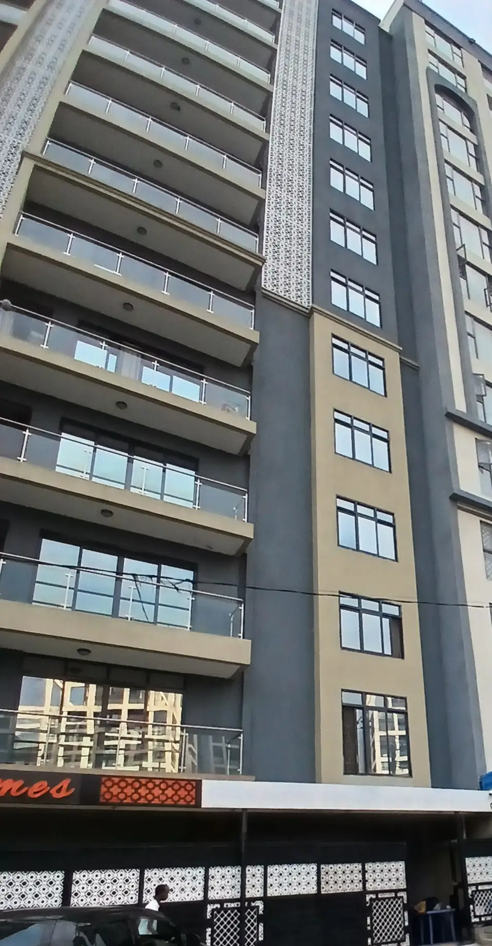 Modern multi-story residential building facade with balconies