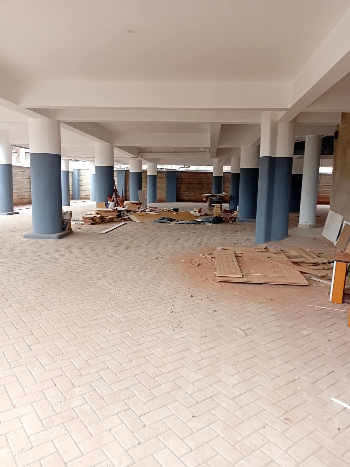 Large empty space under construction with supporting columns
