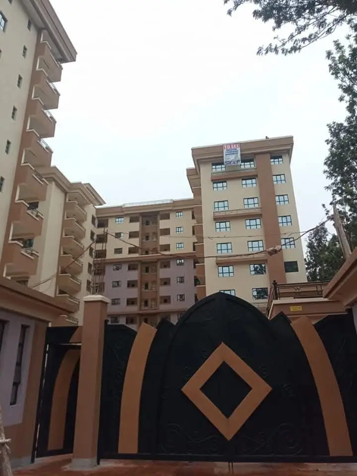 Multi-story residential buildings with compound gate entrance