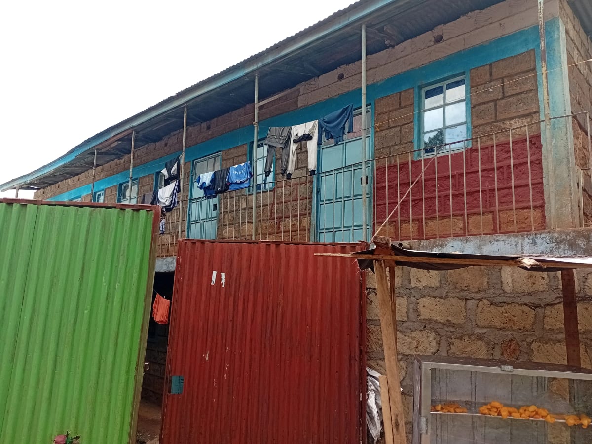 Modest residential building facade with corrugated metal cladding