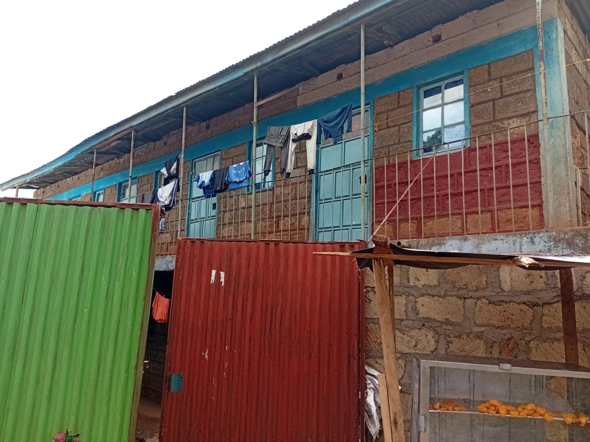 Modest residential building facade with corrugated metal cladding