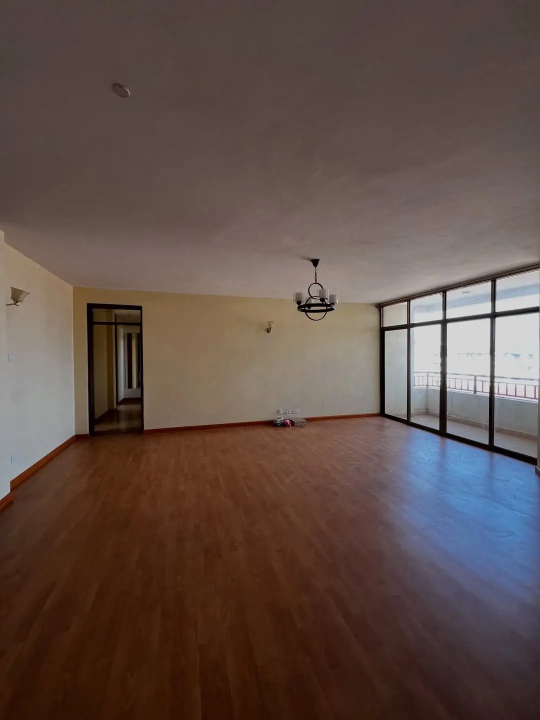 Spacious living room with wooden floors and panoramic windows