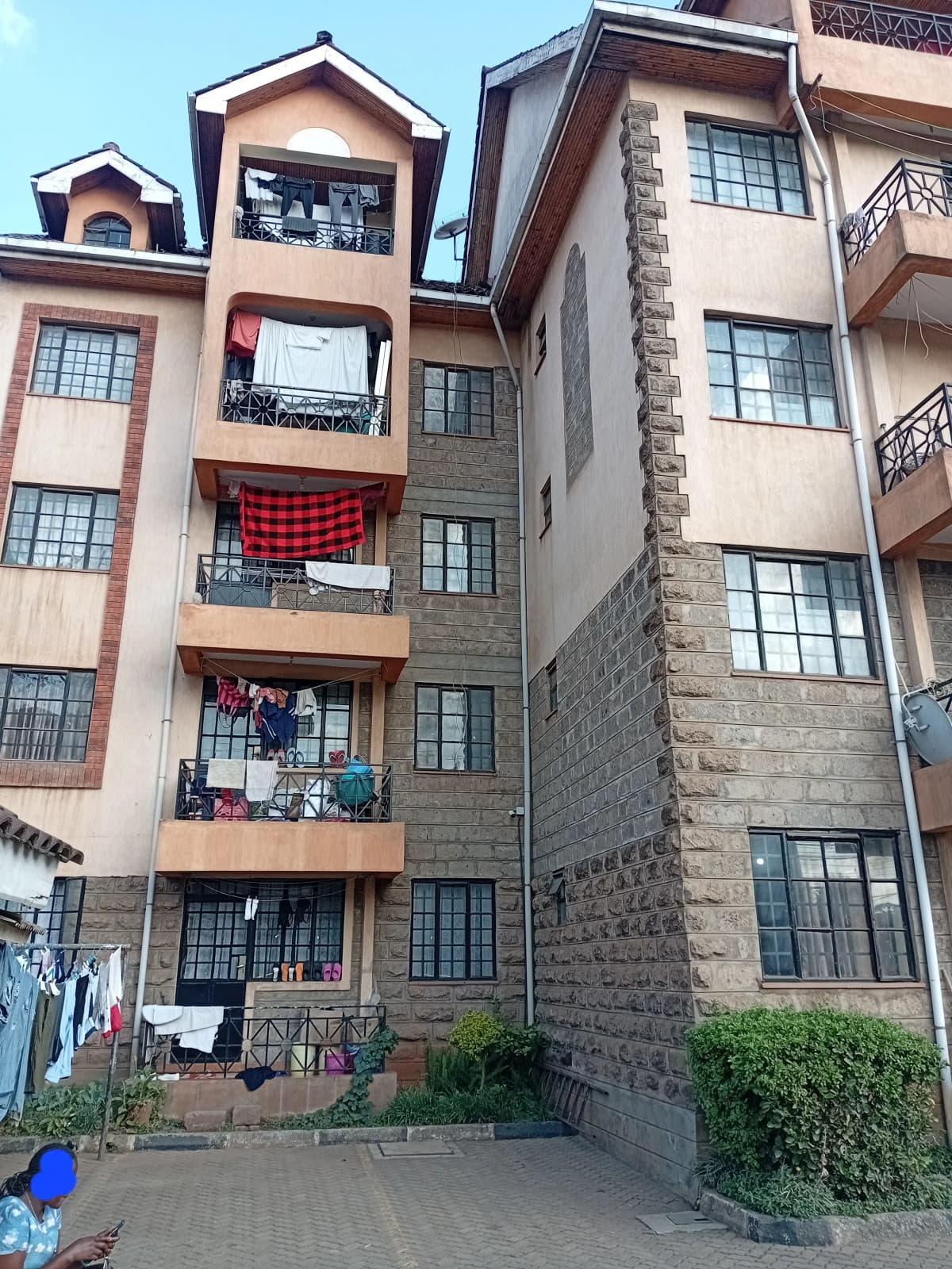Multi-story residential building facade with balconies and windows