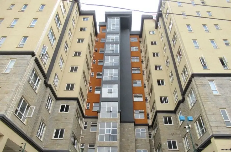Multi-story residential apartment building facade with courtyard view