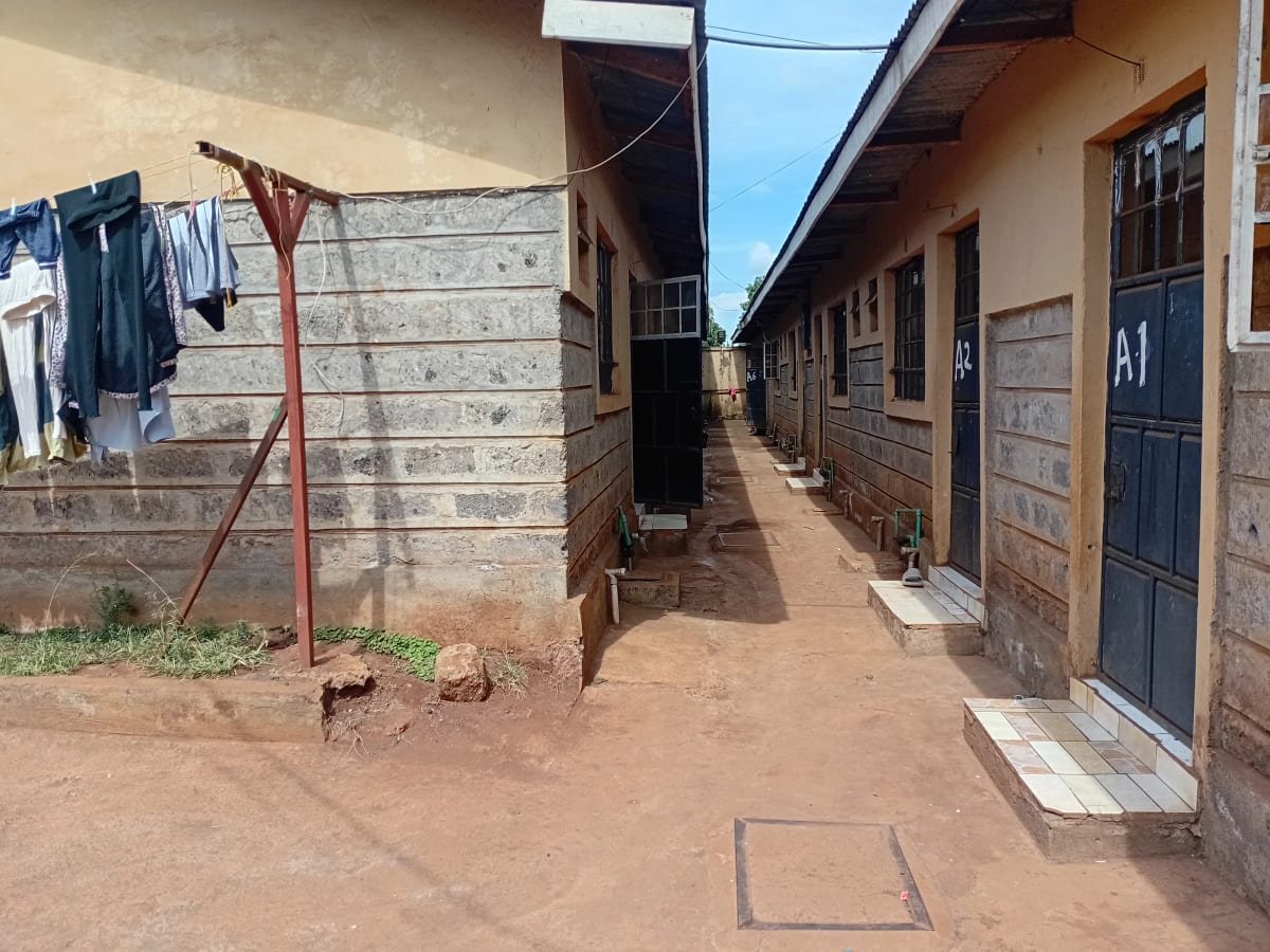Compound alleyway with brick units and clothesline