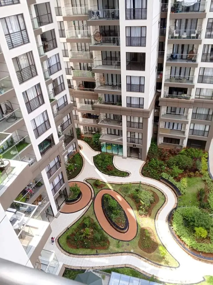Landscaped compound courtyard with curved pathways and greenery