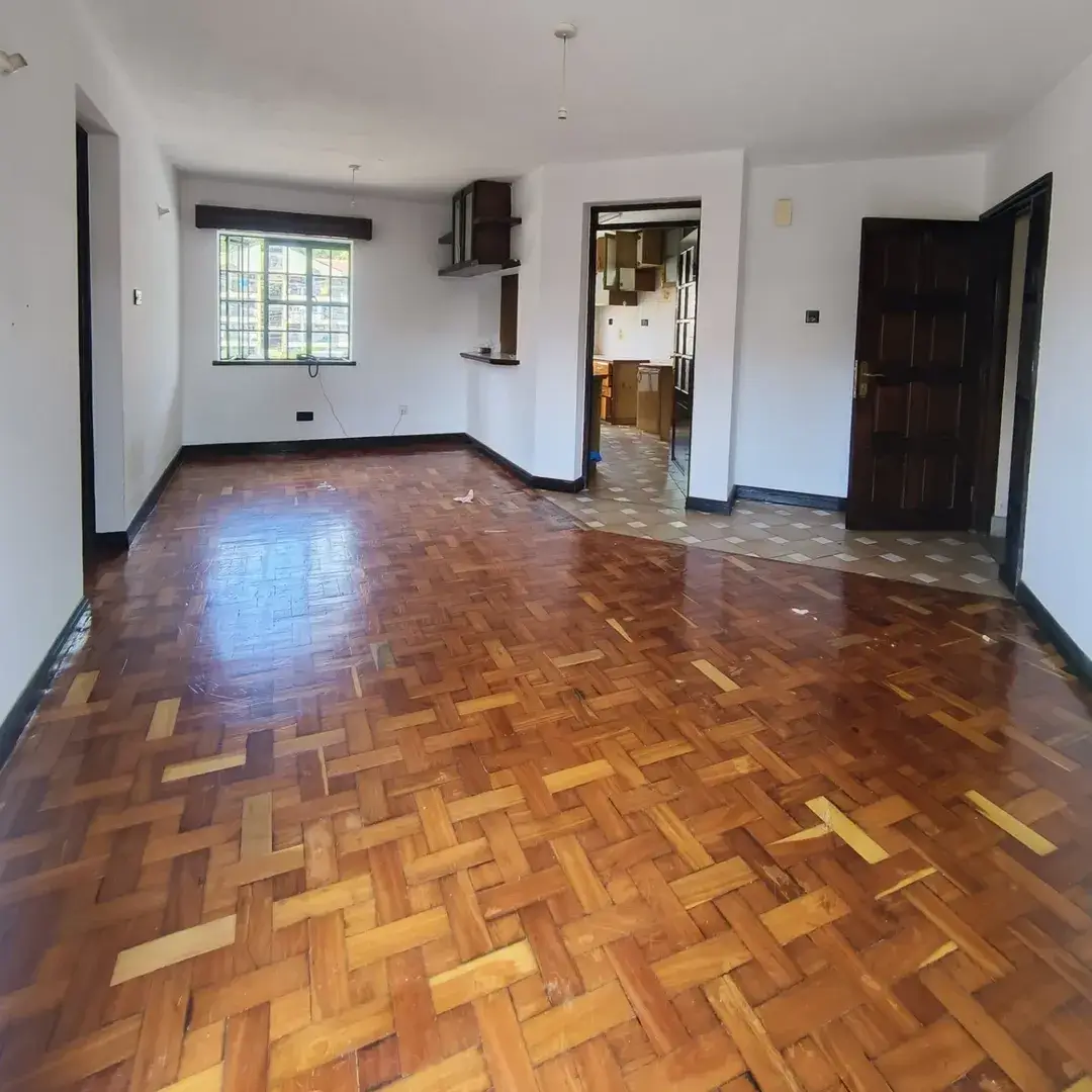 Spacious living room with herringbone parquet flooring