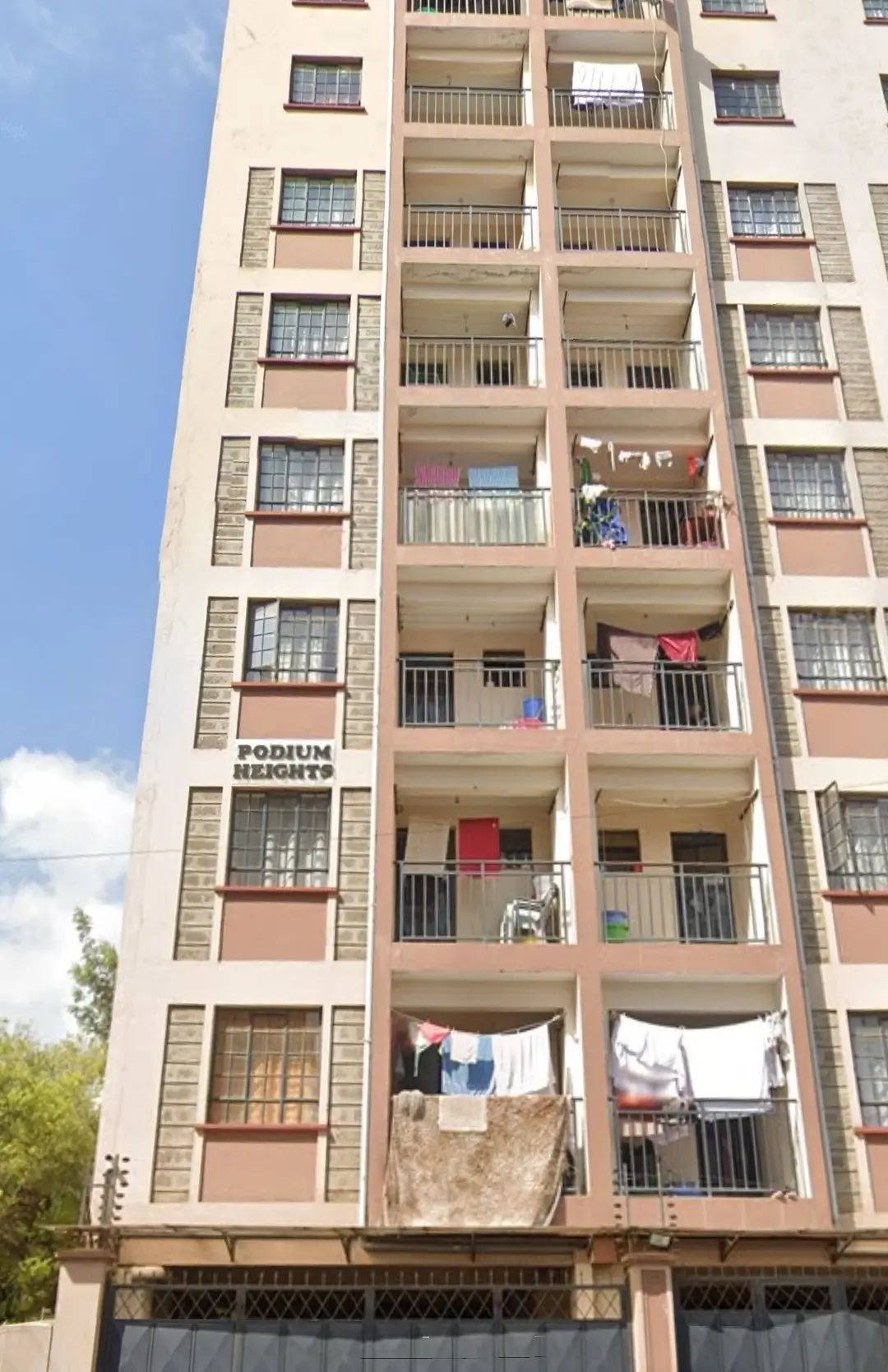 Multi-story residential building facade with balconies and windows