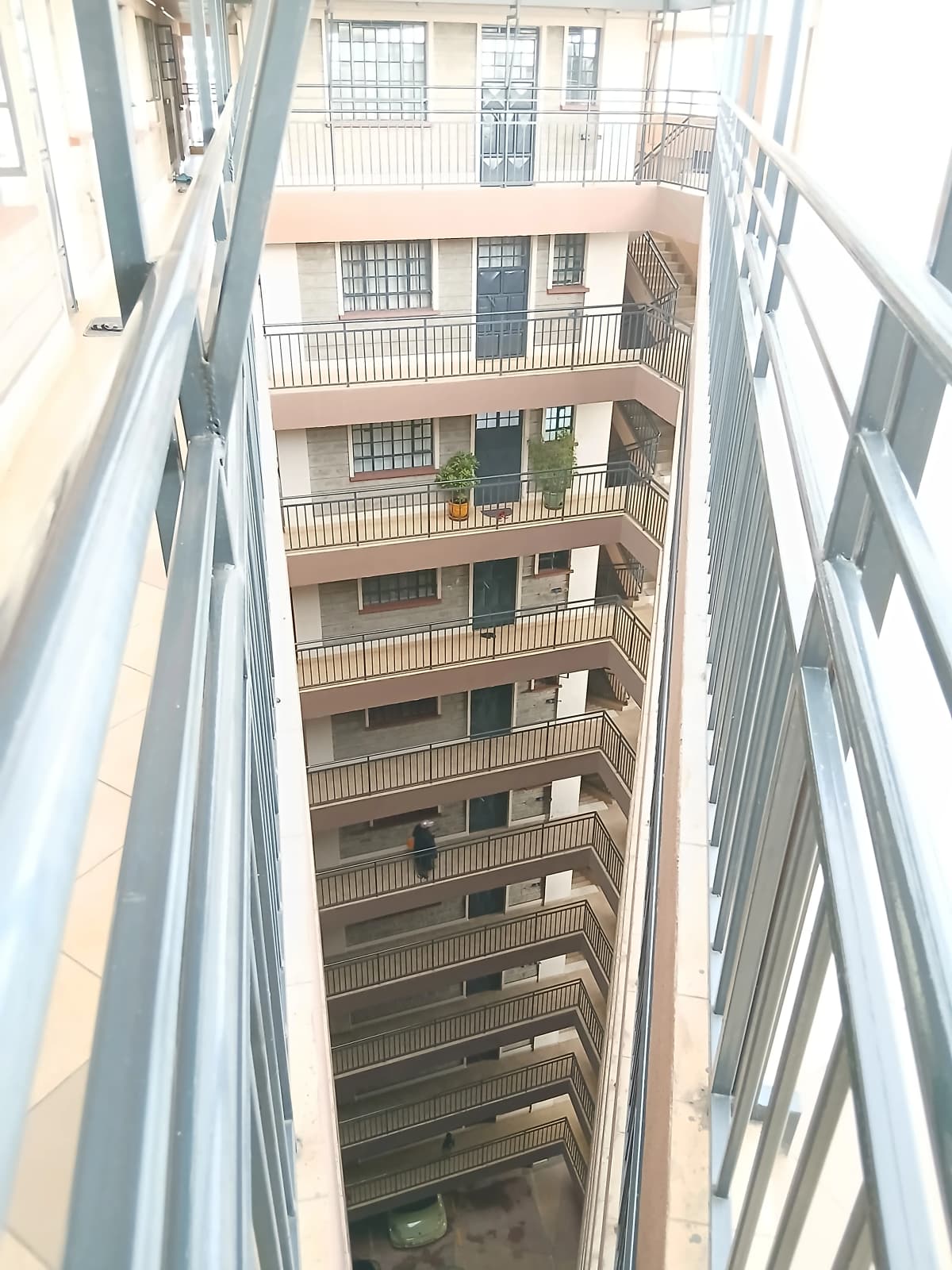 Multi-story residential building atrium with balconies