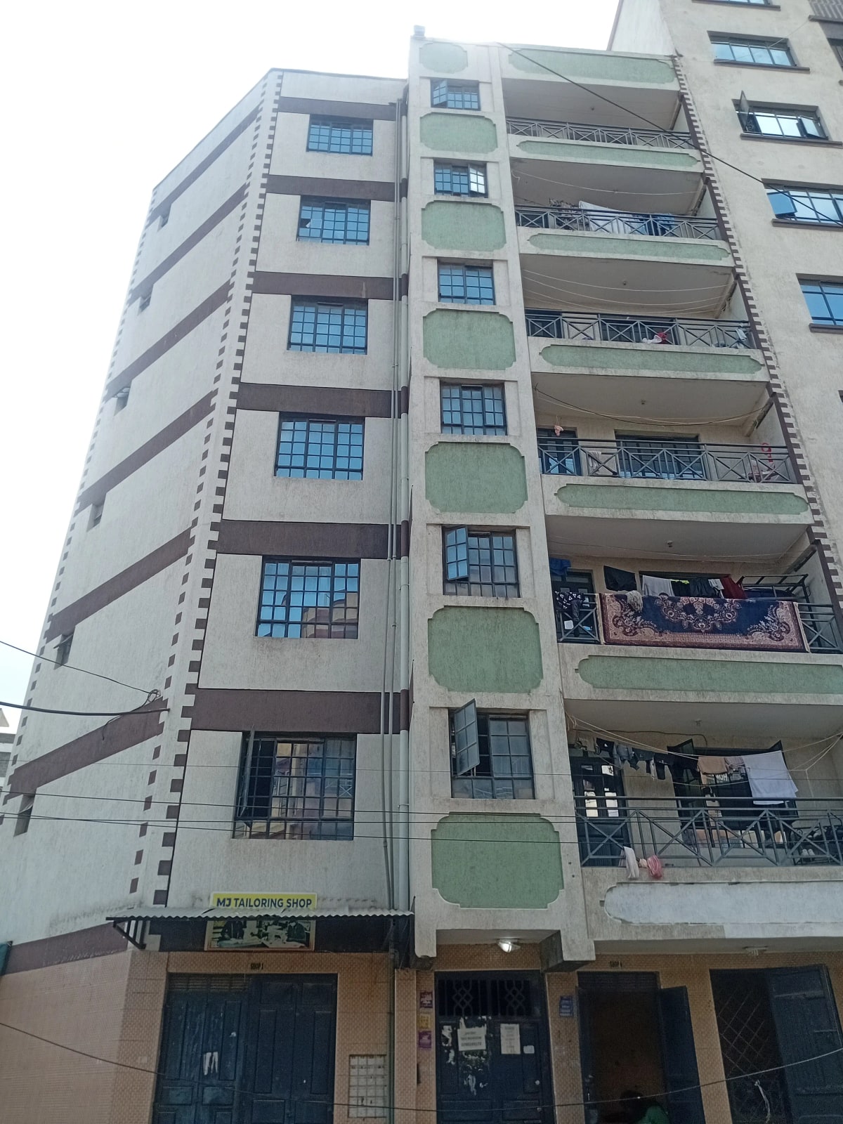 Multi-story residential apartment building facade with balconies