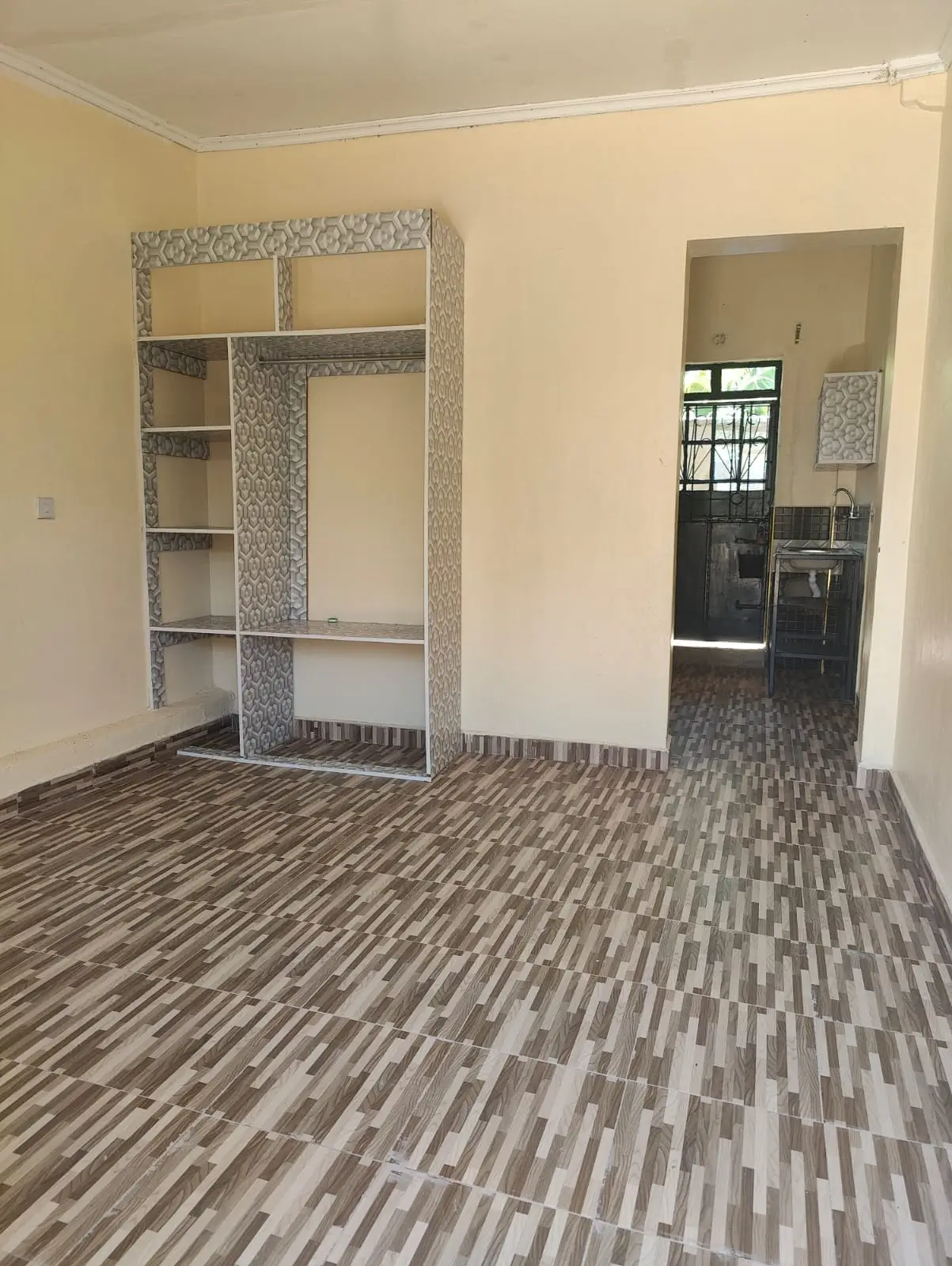 Spacious bedroom with built-in wardrobe and wooden flooring