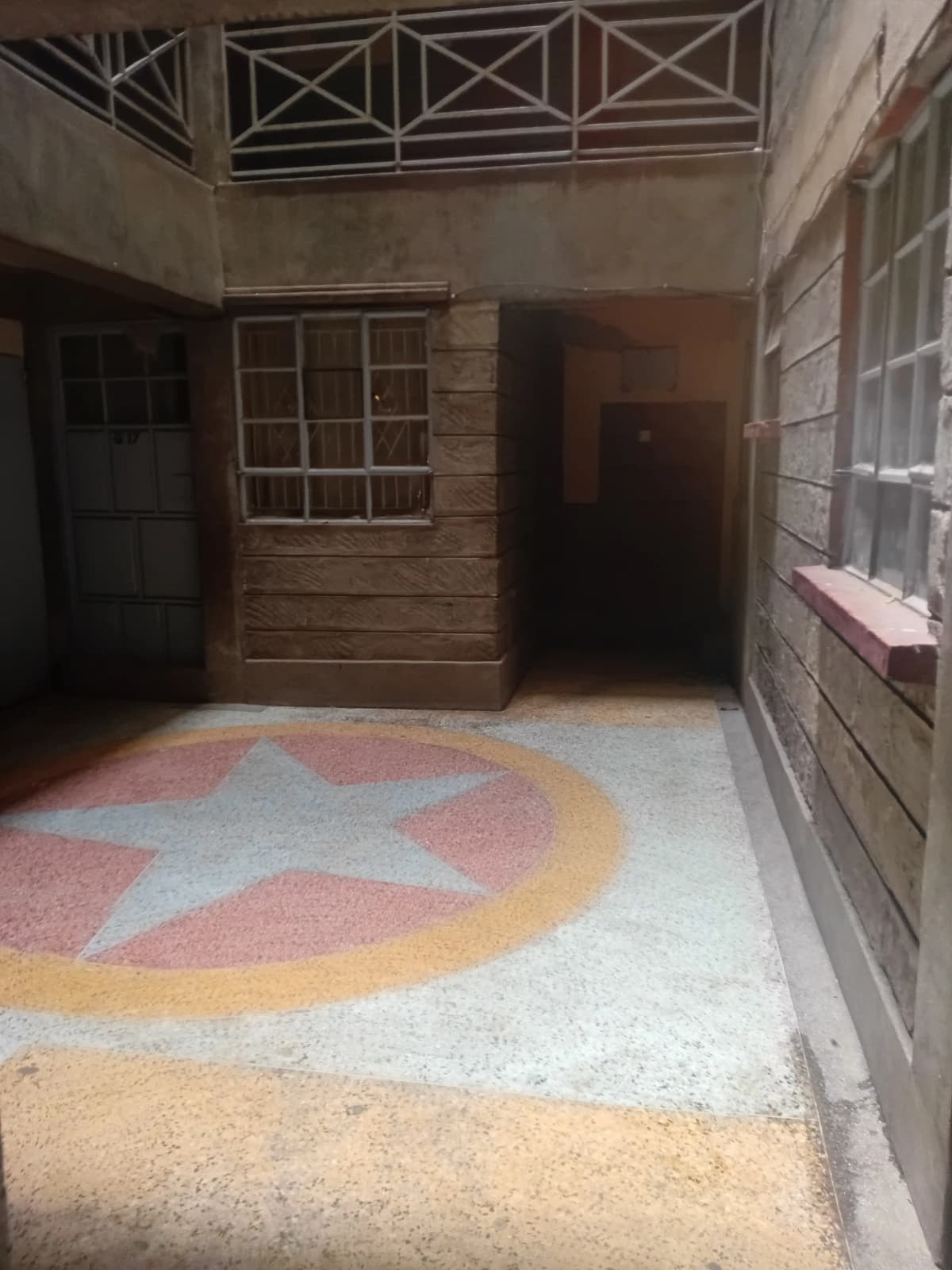 Compound entrance with decorative star floor pattern