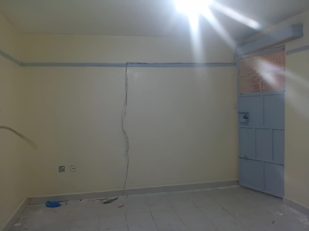 Empty room under construction with minimal fixtures