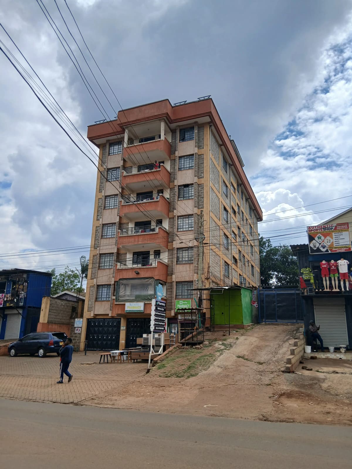 Multi-story residential building with retail ground floor