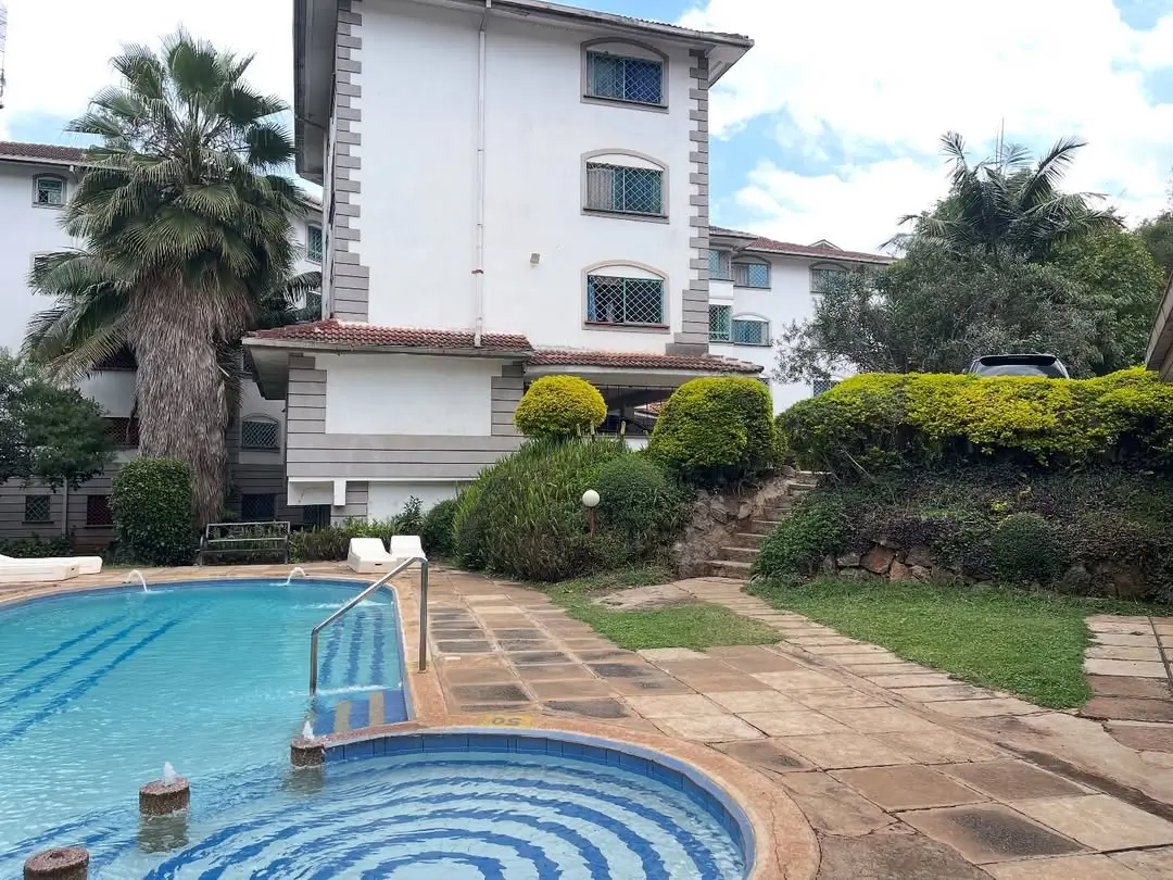 Swimming pool with lounge deck and manicured landscaping