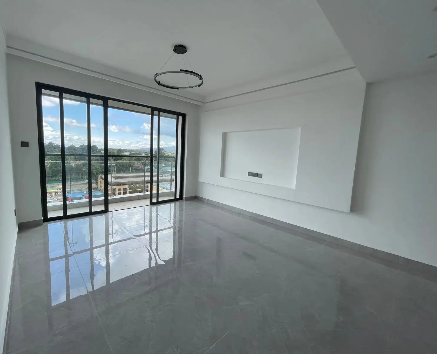 Spacious living room with panoramic city and landscape views