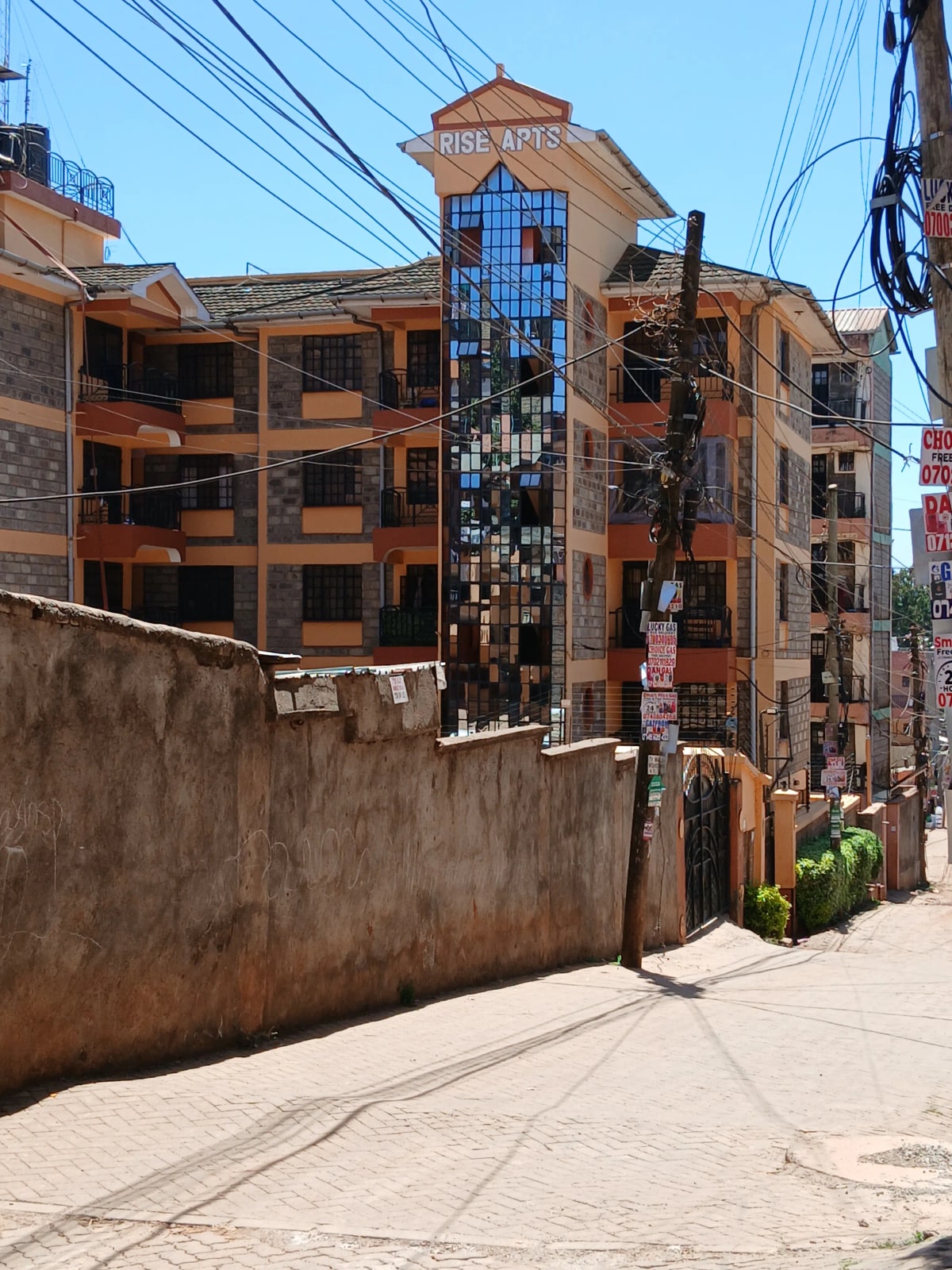 Multi-story residential building facade with street frontage