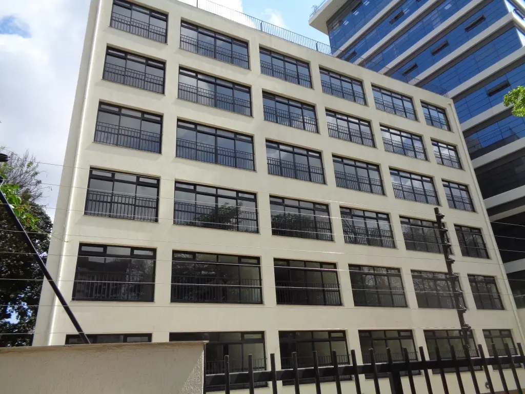 Modern multi-story residential building facade with uniform windows