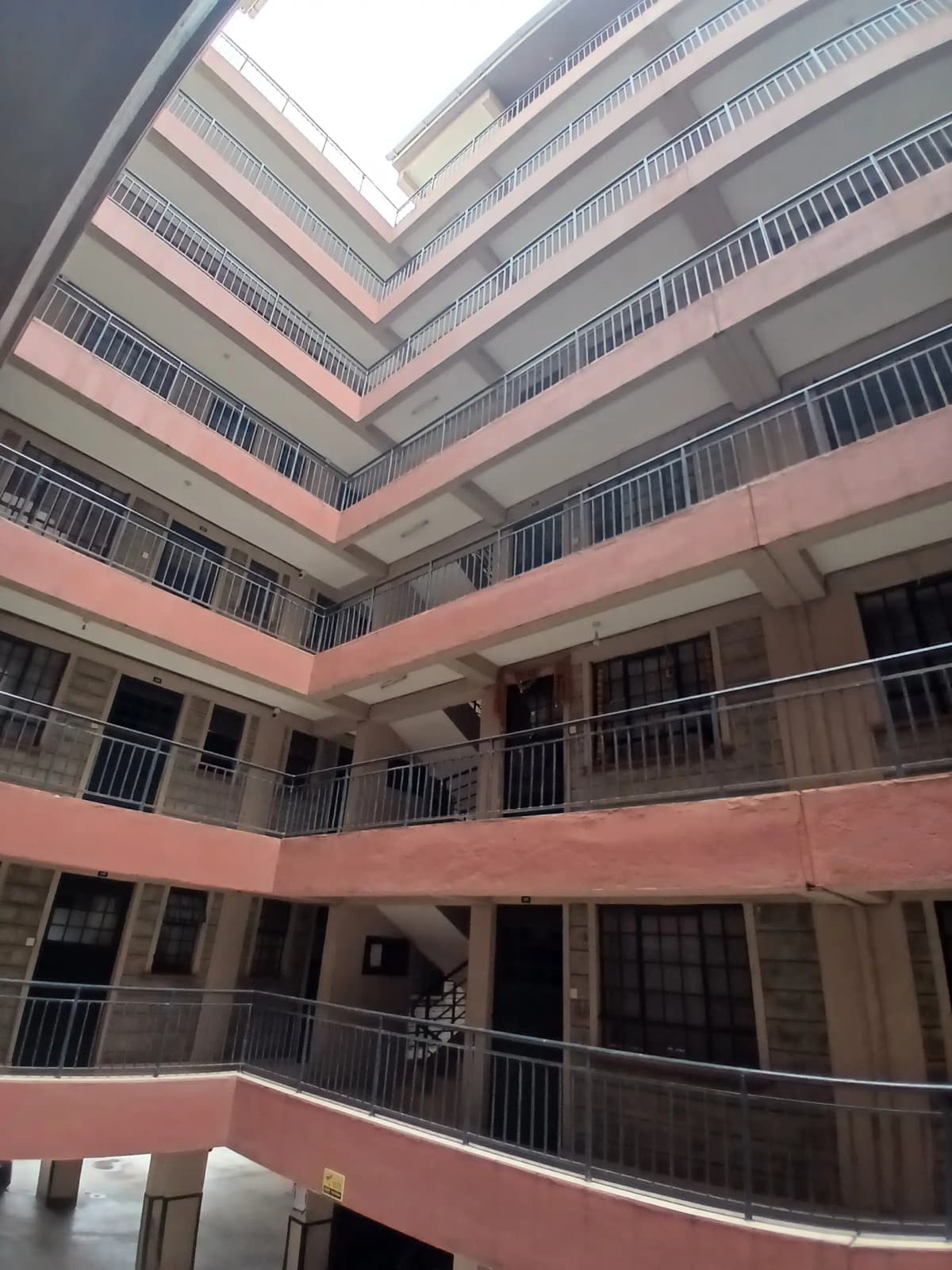 Multi-story residential building interior courtyard view