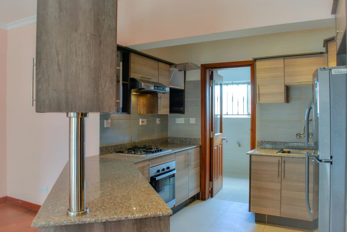 Modern kitchen with granite counters, stainless steel appliances