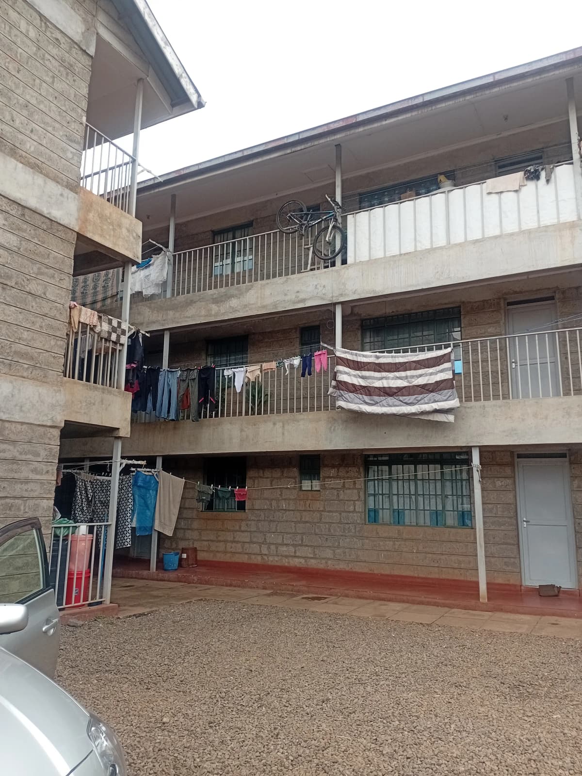 Multi-story residential building with brick facade and balconies