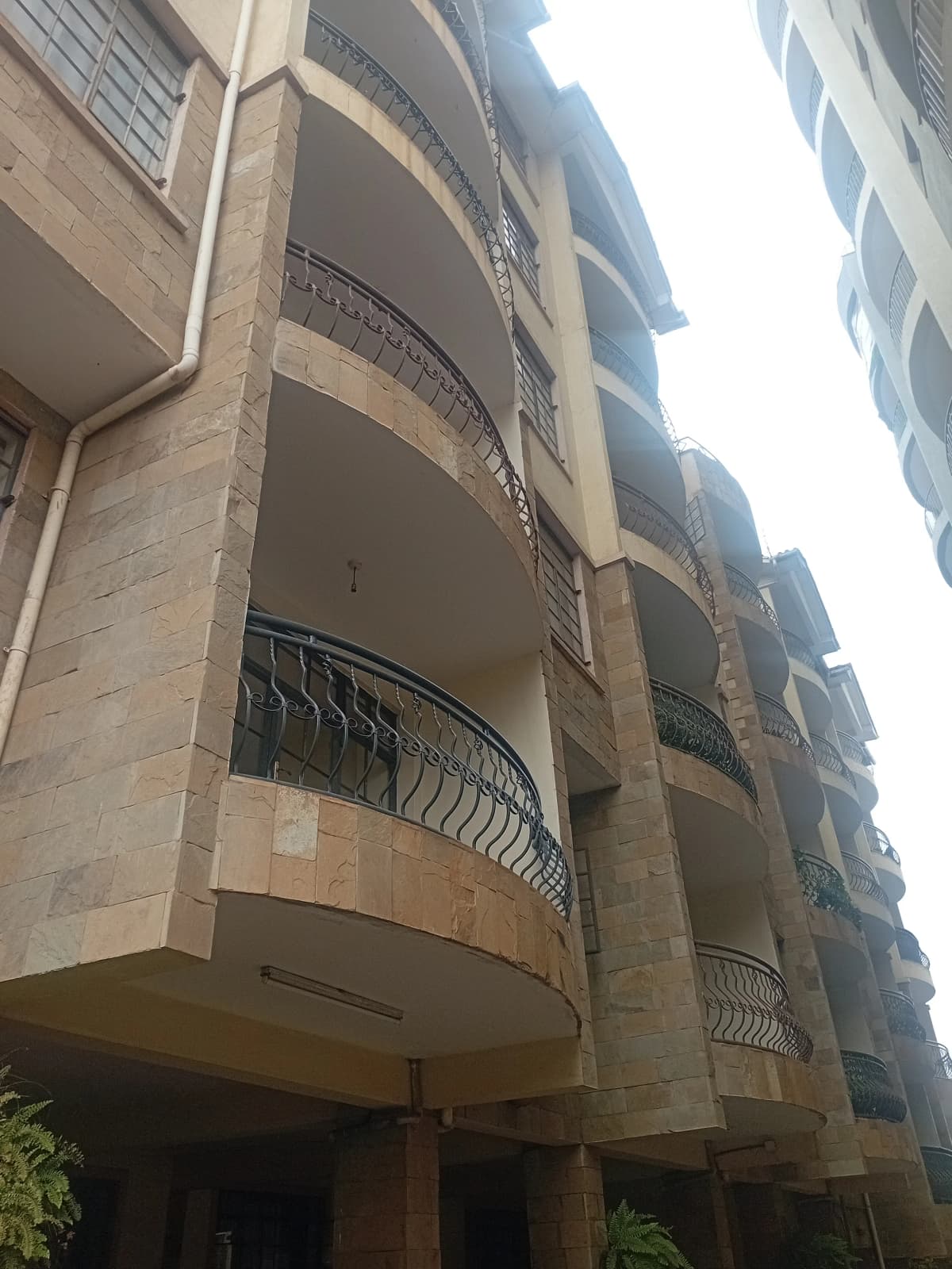 Multi-story residential building facade with balconies