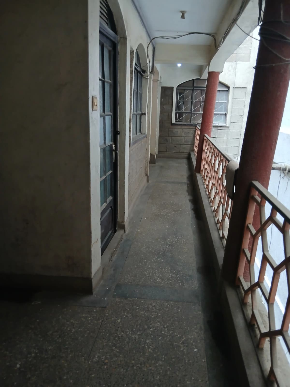 Building corridor with multiple doors and natural light