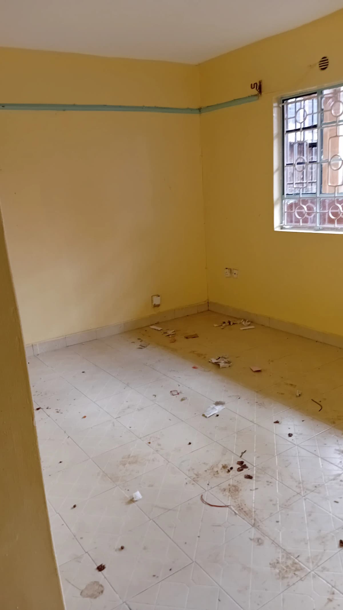 Empty bedroom with yellow walls, under renovation