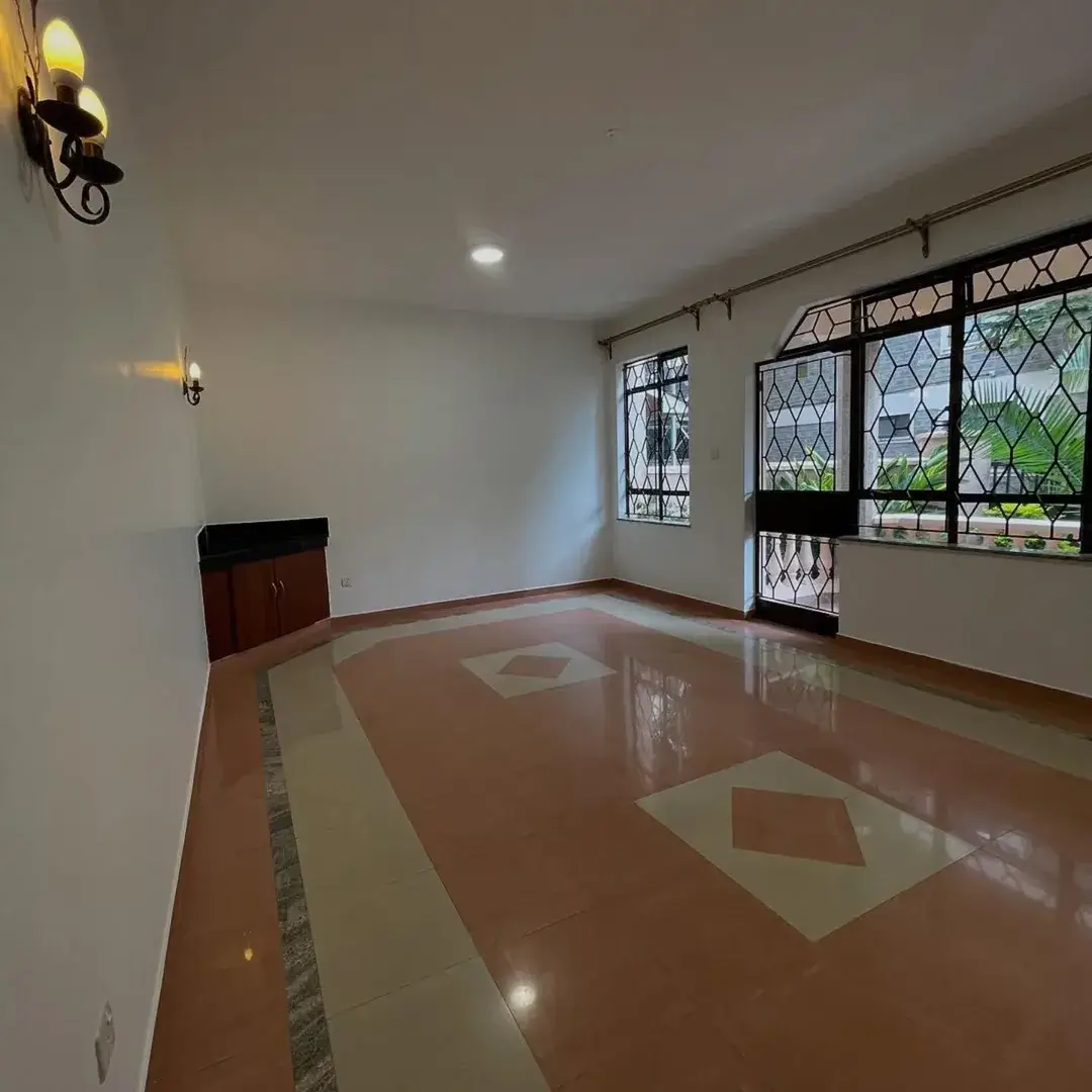 Spacious living room with polished concrete floor and geometric patterns