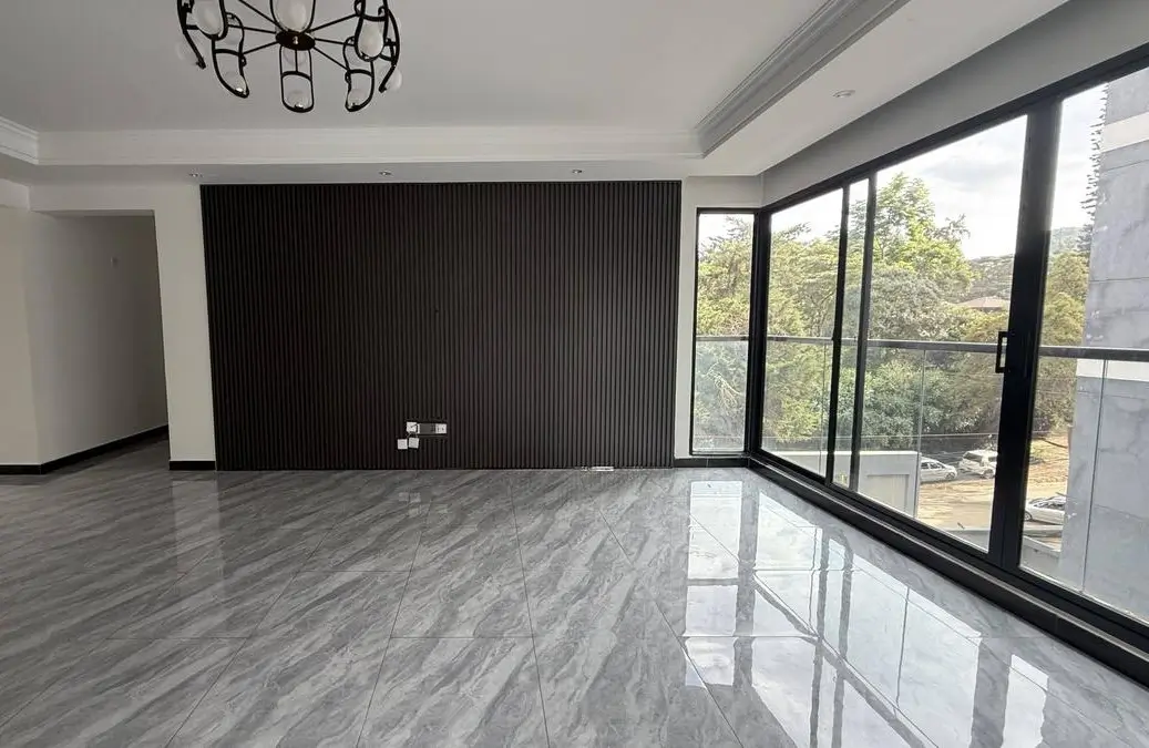 Modern living room with marble flooring and expansive glass doors