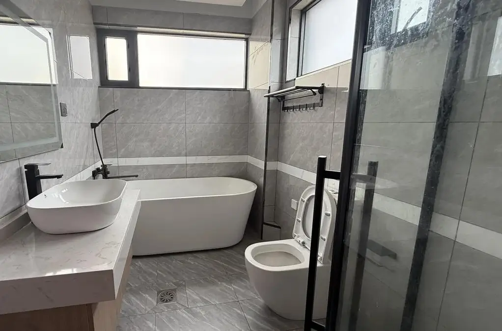 Modern bathroom with freestanding tub and marble finishes