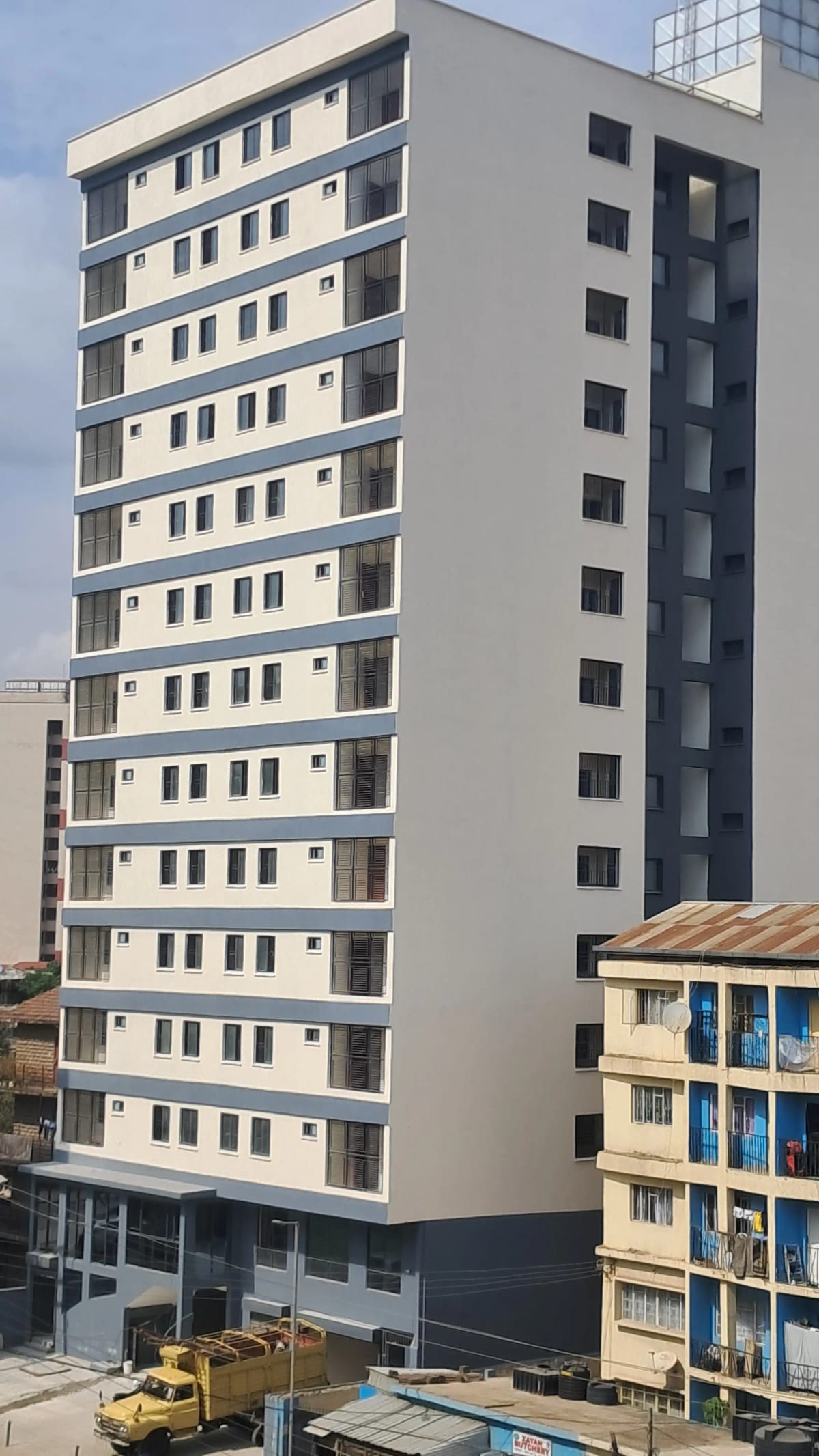 Modern multi-story residential building facade with balconies