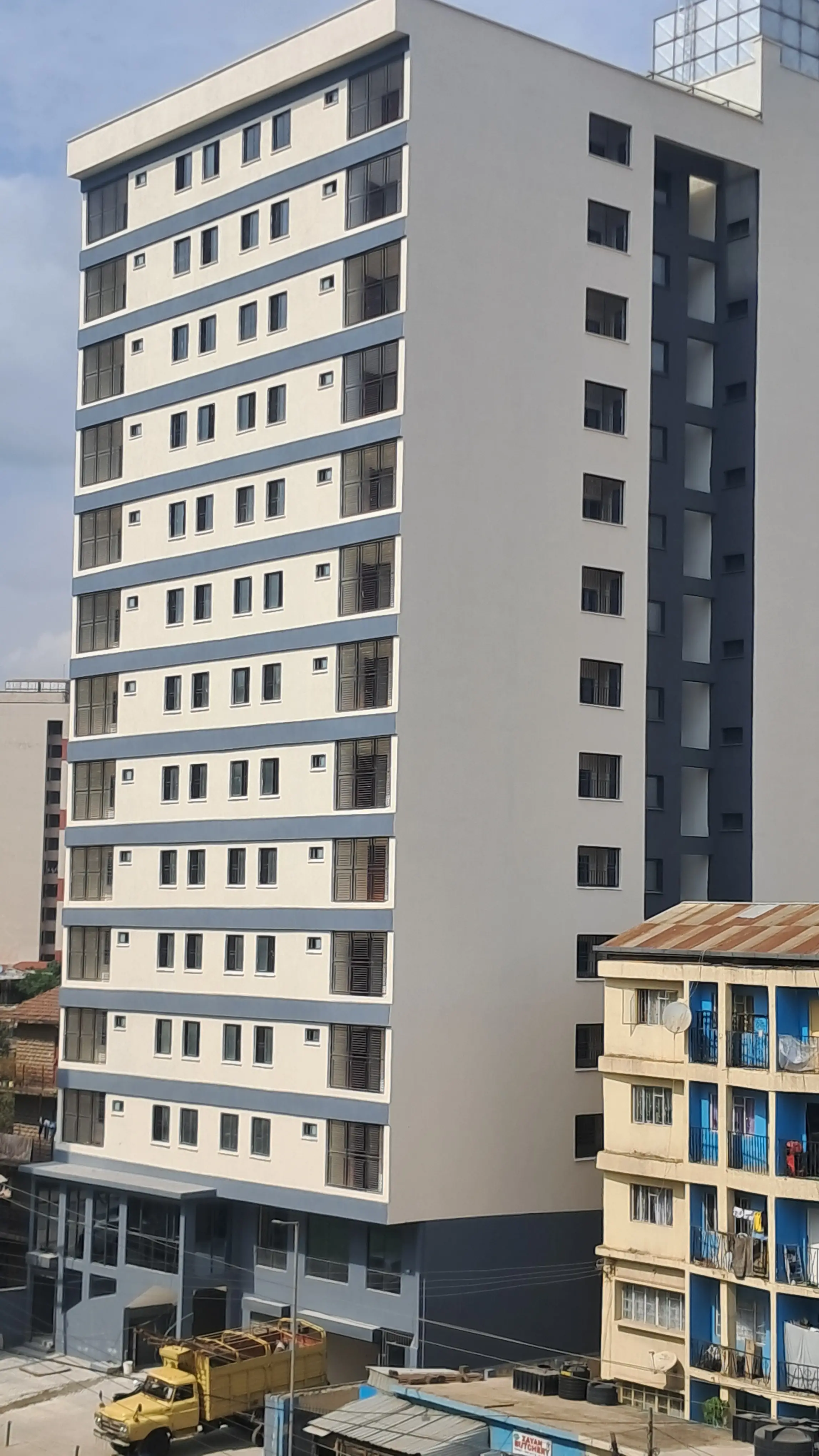 Modern multi-story residential building facade with balconies