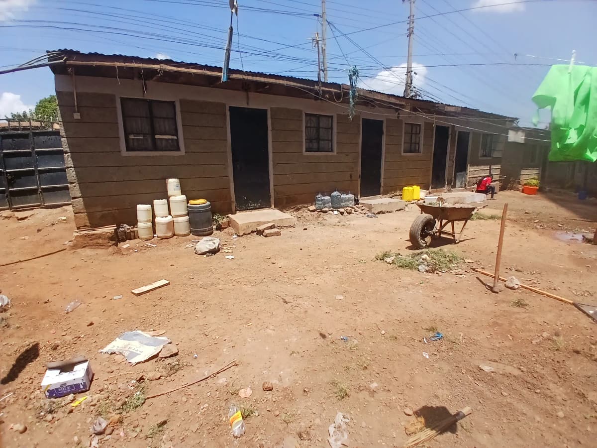 Compound exterior with residential structure under construction