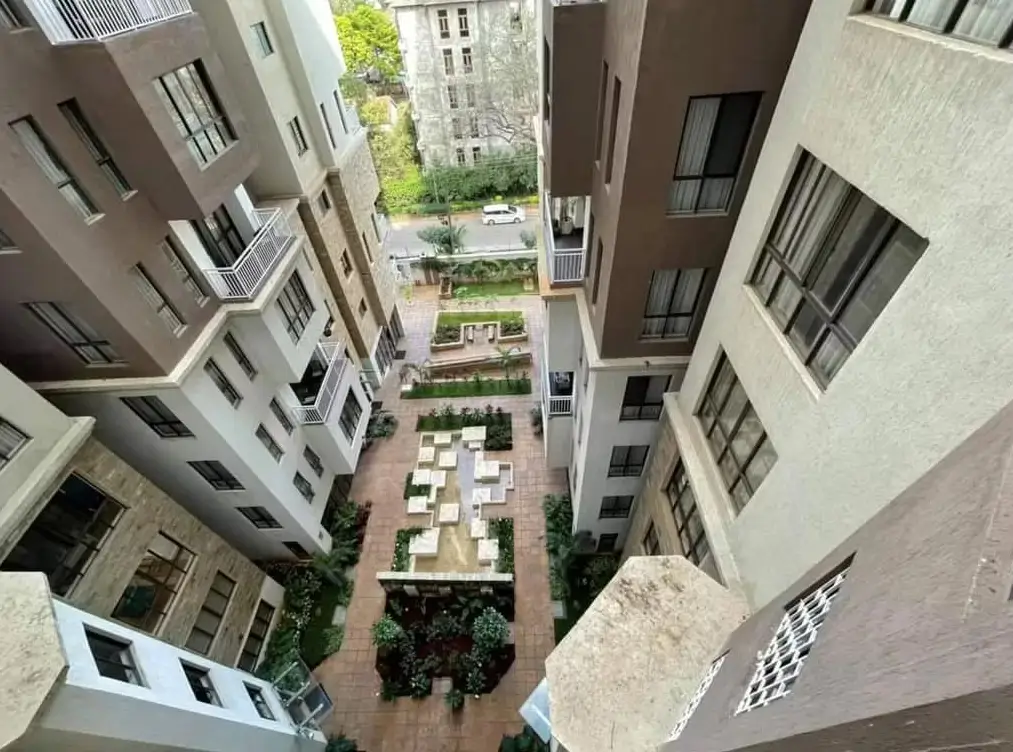 Courtyard garden with landscaping between residential buildings
