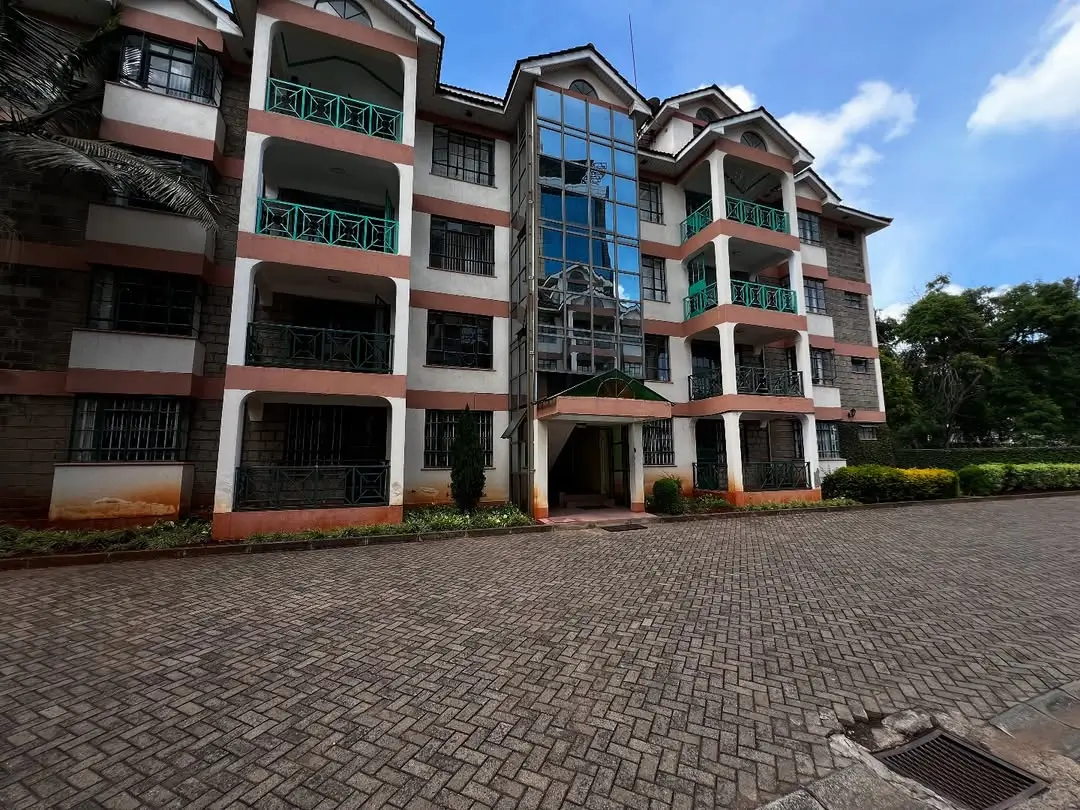 Multi-story residential apartment building with brick facade and balconies