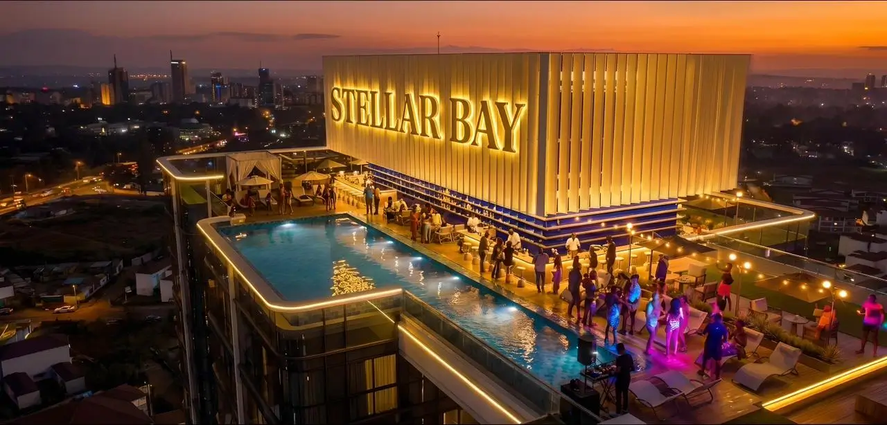 Rooftop infinity pool at sunset with city skyline