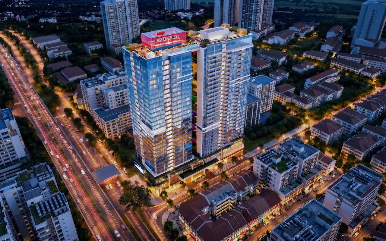 Aerial night view of tall glass residential tower complex