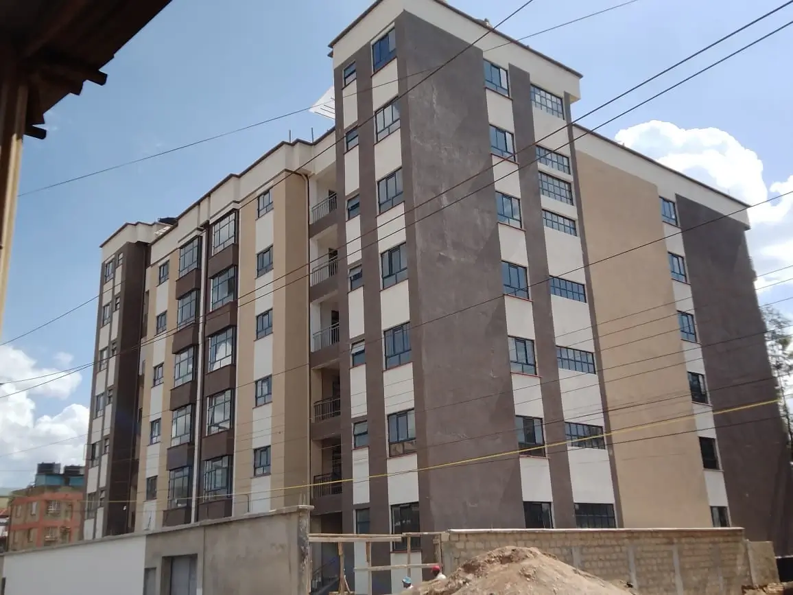 Multi-story residential building facade with uniform windows