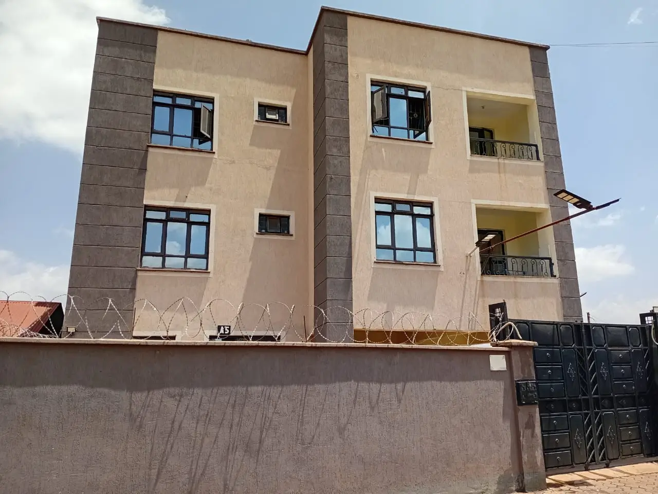 Modern multi-story residential building facade with balconies
