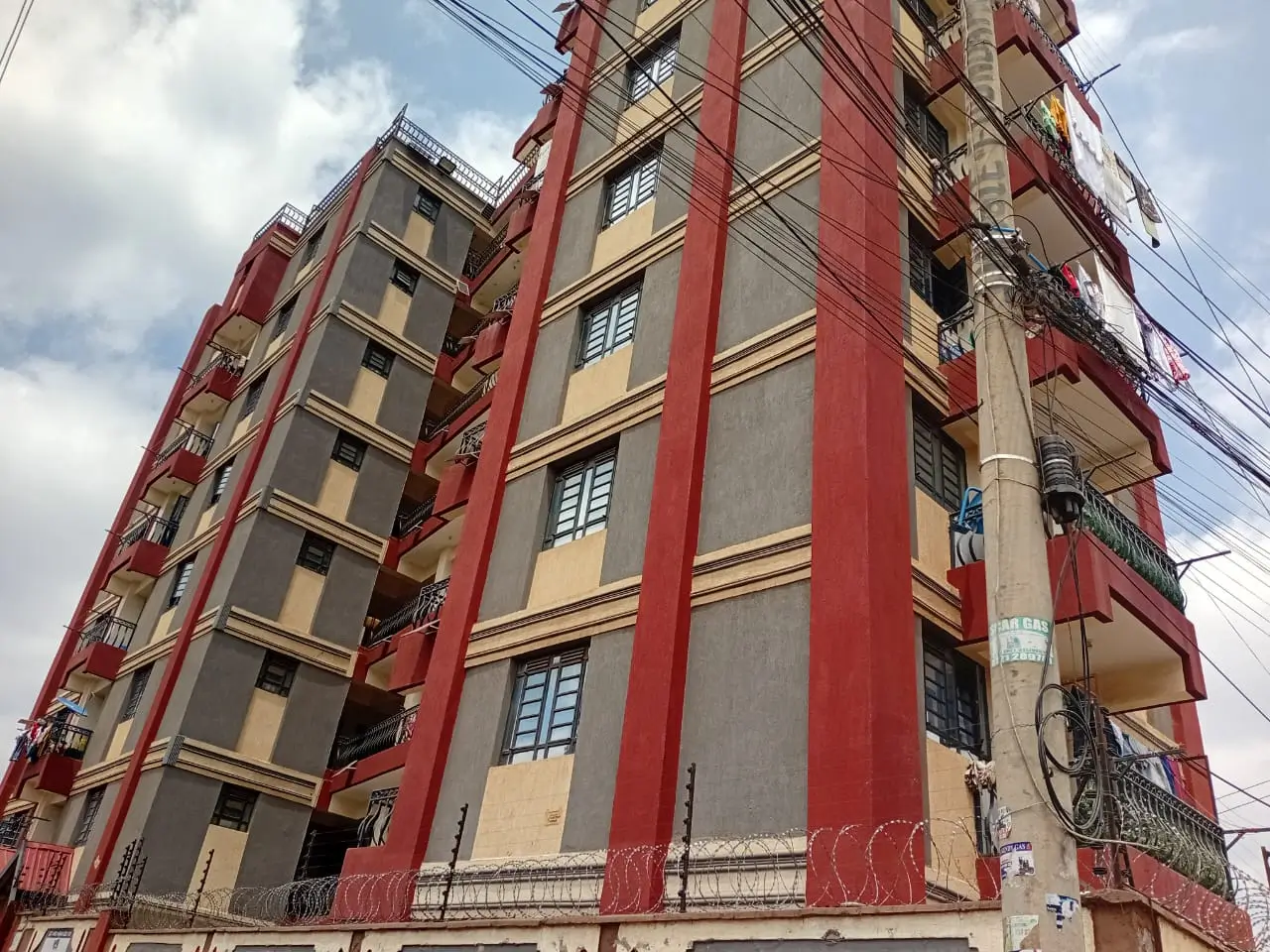 Red and cream multi-story residential building facade